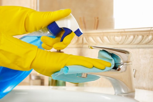 Carpet cleaning technician preparing equipment in a safe home environment